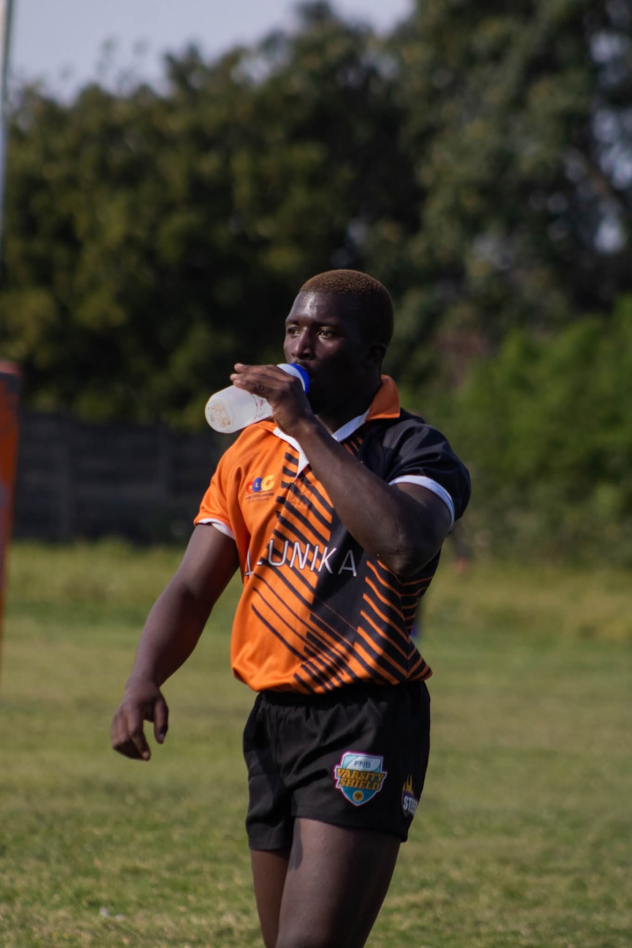 Olutsha Wolves Under-21 player taking on water during a break